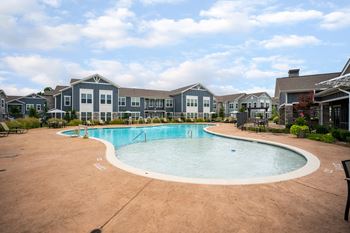Resort-style swimming pool with cabanas